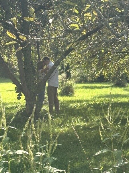 Morgan and Samuel kiss under the tree after she says yes